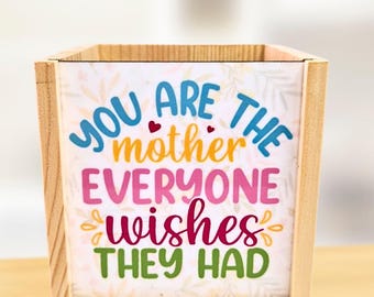 White background with small reading - personalised pen pot - crafted from spruce pine - a stylish desk touch - vibrant colours
