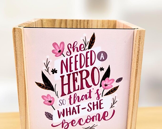 Pink background with small reading  - personalised pen pot - crafted from spruce pine - a stylish desk touch - vibrant colours
