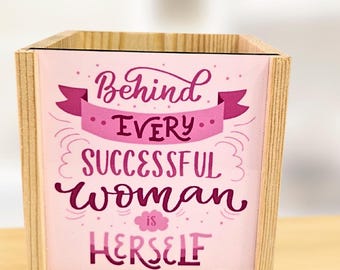 Pink background with small reading  - personalised pen pot - crafted from spruce pine - a stylish desk touch - vibrant colours