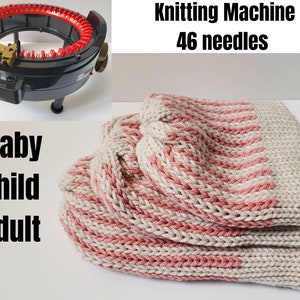 May include: A black and red knitting machine with 46 needles is shown next to a stack of knitted fabric. The fabric is beige with pink stripes. Text on the image reads "Baby Child Adult".