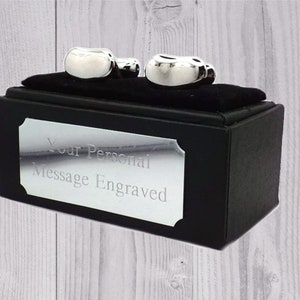 May include: Silver cufflinks in a black box with a silver plaque that reads "Your Personal Message Engraved".
