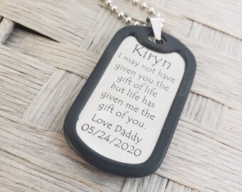 May include: A black dog tag necklace with the inscription "Kiryn I may not have given you the gift of life but life has given me the gift of you. Love Daddy 05/24/2020"