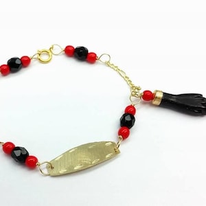 NEW 10K GOLD AZABACHE BABY BRACELET (PROTECTION FROM EVIL EYE) Pulsera Azabache. pulsera azabache de oro 
PULSERA MANO DE AZABACHE BEBE DE ORO (MAL DE OJO). 10K Solid Gold Azabache Bracelet for newborn babies 
Also called "Mano de Azabache"