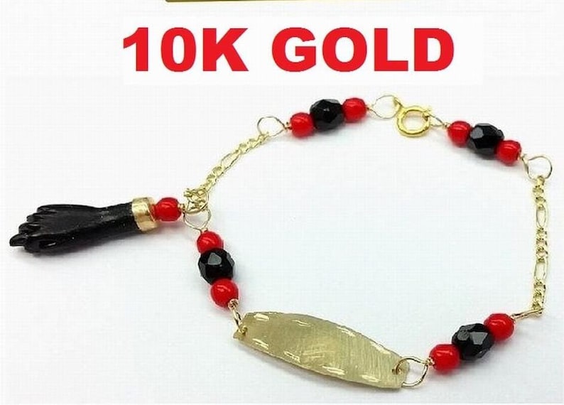 New 10K Gold Azabache Baby Bracelet (Evil Eye Protection) Pulsera Mano de Azabache Bebe De Oro Para Mal De Ojo. 10K Solid Gold Azabache Bracelet for newborn babies to protect them from the evil eye.
Also called "Mano de Azabache"