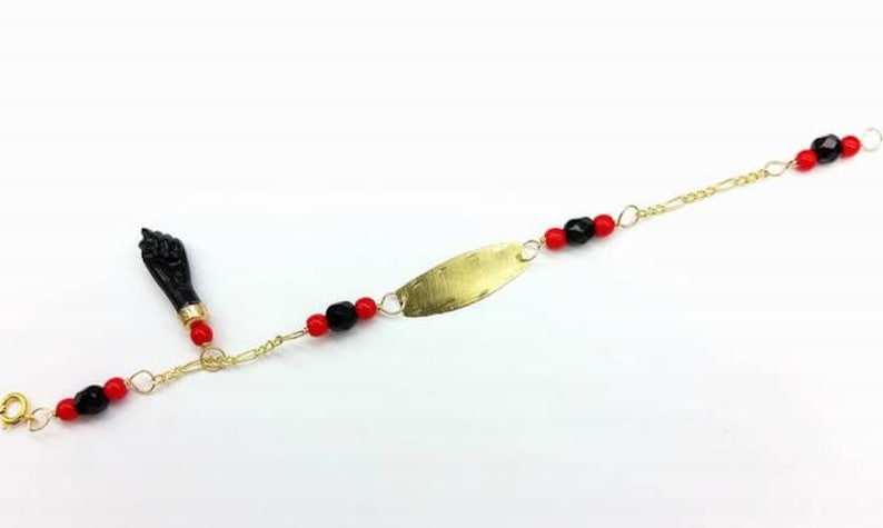 NEW 10K GOLD AZABACHE BABY BRACELET (PROTECTION FROM EVIL EYE) Pulsera Azabache de oro 
PULSERA MANO DE AZABACHE BEBE DE ORO (MAL DE OJO)