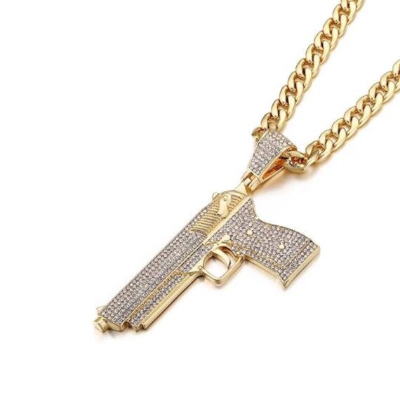 Iced out gun pendant sale