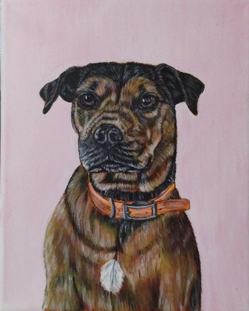 May include: Painting of a brown and black dog with a black nose and brown eyes. The dog is wearing an orange collar with a silver buckle and a white feather charm. The dog is sitting and looking directly at the viewer. The background is a light pink.