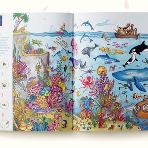 May include: A colorful children's book spread depicting the Great Barrier Reef in Australia. The illustration features diverse marine life including whales, dolphins, an octopus, and coral reefs, alongside a search-and-find activity list with icons.