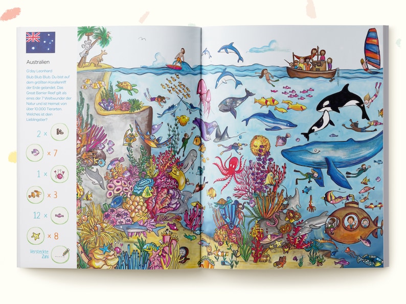 May include: A colorful children's book spread depicting the Great Barrier Reef in Australia. The illustration features diverse marine life including whales, dolphins, an octopus, and coral reefs, alongside a search-and-find activity list with icons.