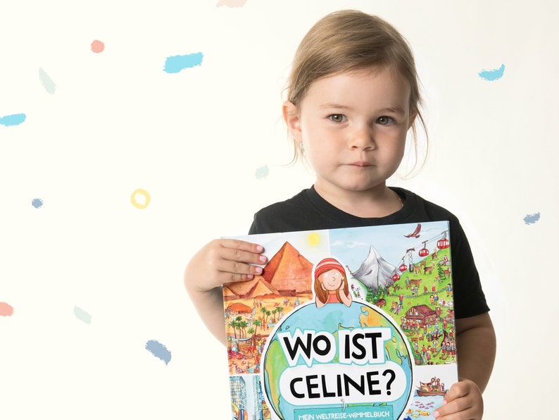 May include: A hardcover children's book titled Wo ist Celine? featuring a colorful illustrated cover with a globe, pyramids, mountains, and a cartoon character. The book cover displays the text Wo ist Celine? and Mein Weltreise-Wimmelbuch.