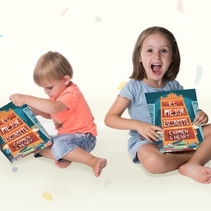 May include: A children's picture book titled El Mejor Escondite, featuring an illustration of a large wooden bookshelf filled with books on the cover, with the text Carmen & Henry displayed prominently in white and orange lettering.