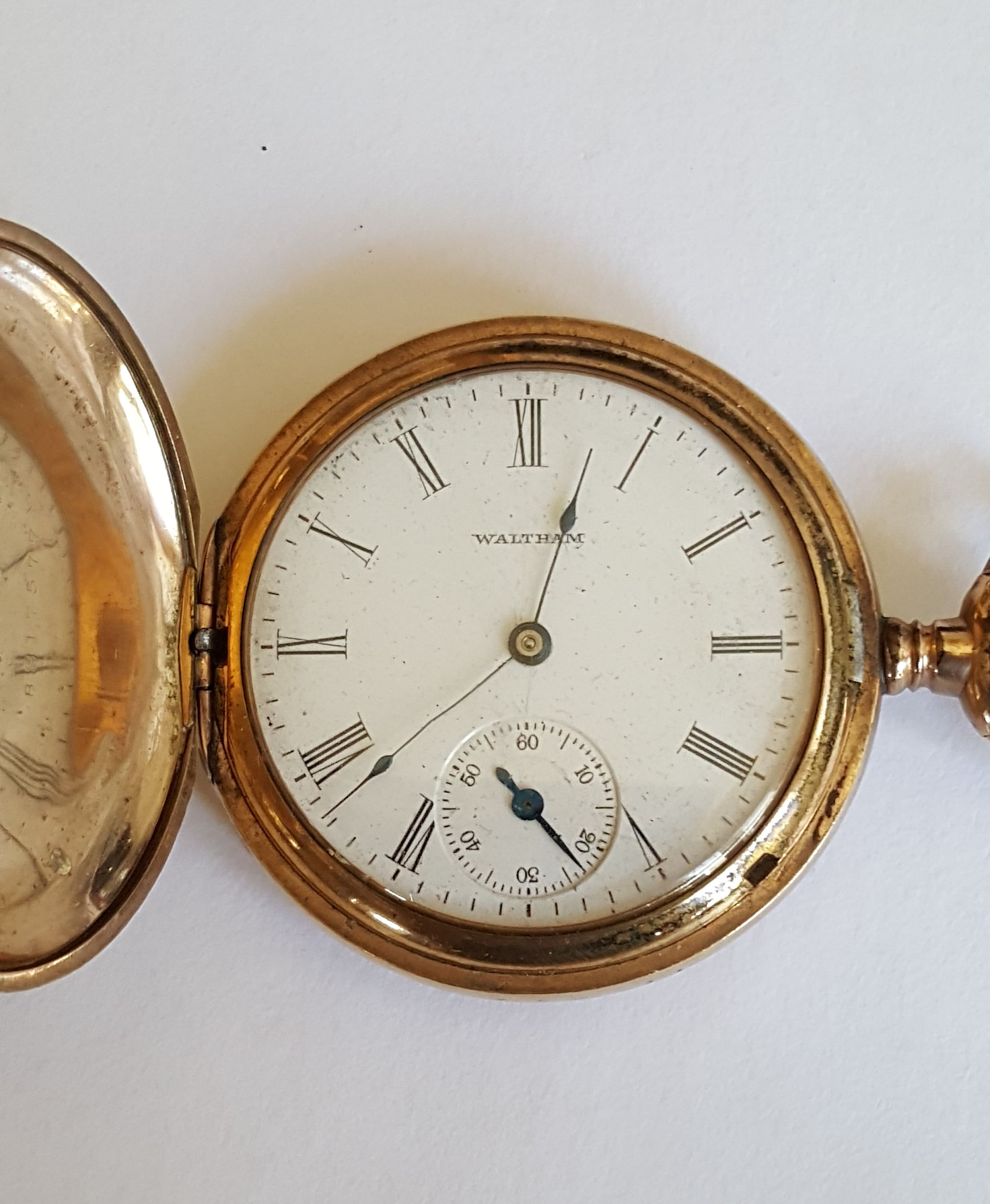Gold waltham pocket watch value hotsell
