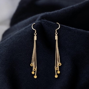 Guitar String Drop Earrings: Made with repurposed stainless steel guitar strings and ball ends