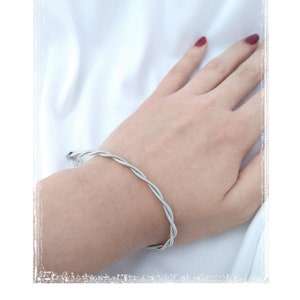 Guitar string bracelet made with two twisted stainless steel repurposed guitar strings. Perfect for that rocker in your life!