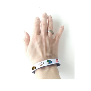 Visual communication aid, personalized fabric bracelet to help with communication.  Totally customized by you to fit your needs!