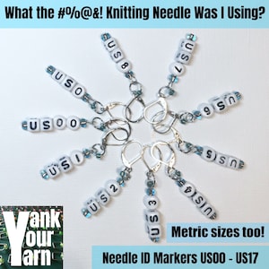 May include: A set of ten knitting needle size markers, each with a white bead with black lettering indicating the US size of the needle. The markers are attached to silver rings. The text "Needle ID Markers US00 - US17" and "Metric sizes too!" are visible in the image.