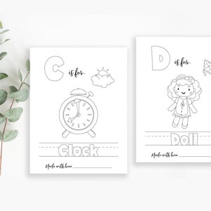May include: Two black and white printable alphabet flashcards. The first card features the letter C and a clock. The second card features the letter D and a doll. Both cards have the text "is for..." and "Made with love".