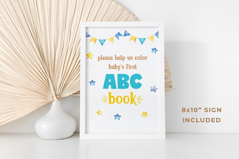 May include: White frame with a printable sign that says "Please help us color baby's first ABC book". The sign has a blue and yellow color scheme with stars and bunting. The sign is 8x10 inches.