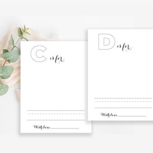May include: Two printable alphabet cards featuring the letters C and D. Each card includes a space to write what the letter stands for and a line for a signature. The text on the cards reads "C is for..." and "D is for..." with the words "With love" at the bottom of each card.