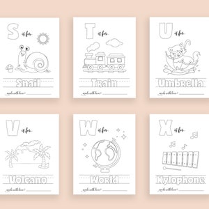 May include: Black and white printable alphabet flash cards featuring illustrations of a snail, train, umbrella, volcano, world, and xylophone. Each card has a letter, the word "is for", and the name of the object.