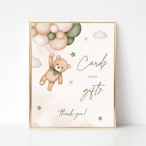 May include: A printable sign with a cute teddy bear holding onto green and pink balloons. The sign says "Cards and gifts" with a thank you at the bottom.