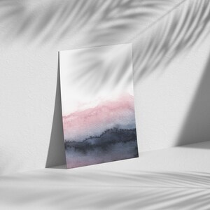 May include: A watercolour painting with a gradient of pink, blue, and black. The colours blend together to create a soft, abstract design.