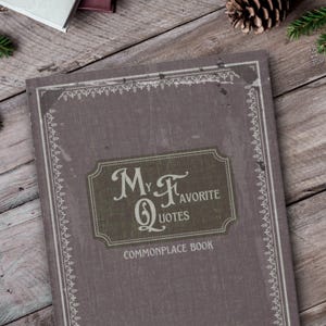 May include: A brown, textured journal with a decorative border and a label that reads "My Favourite Quotes Commonplace Book".