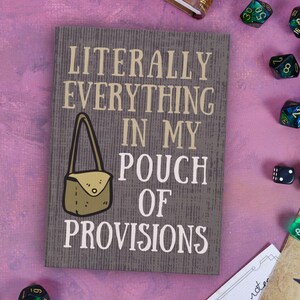 May include: A gray wooden sign with the text "LITERALLY EVERYTHING IN MY POUCH OF PROVISIONS" in white lettering. A cartoon illustration of a brown pouch with a strap is in the center of the sign.