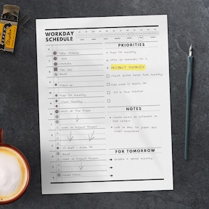 May include: A black and white printable daily schedule planner with a section for workday schedule, priorities, notes, and for tomorrow. The planner includes a list of tasks for the day, such as "Take vitamins", "Prep for meeting", "Work on Project Phoenix", and "Head home".