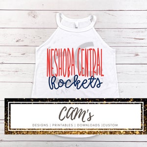 May include: White tank top with the text "Neshoba Central Rockets" in red and blue lettering. The text is in a handwritten style font. The tank top is on a white wood background.