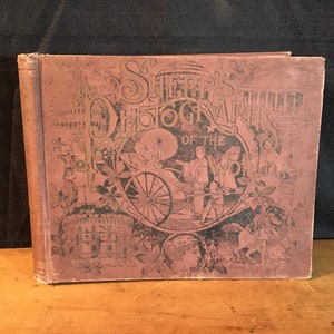 Könnte beinhalten: Ein Vintage-Buch mit dem Titel "Shepp's Photographs of the World" mit einem braunen Einband und aufwendigen Illustrationen eines Rikschas, eines Schlosses und anderer Szenen.