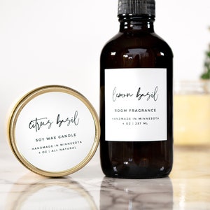 May include: Two glass bottles with labels. The bottle on the left is a soy wax candle with a gold lid and the label reads "Citrus Basil Soy Wax Candle Handmade in Minnesota 4 oz All Natural". The bottle on the right is a room fragrance with a white label that reads "Lemon Basil Room Fragrance Handmade in Minnesota 4 oz | 237 ml".