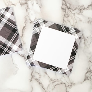 May include: Two square notepads with a gray plaid pattern. One notepad has a blank white square in the center. The text "Design Shown: Gray Plaid" is at the bottom. The brand name "Nest & Note Print Co." is at the top.