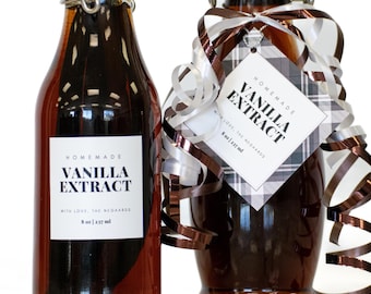 May include: Two glass bottles of homemade vanilla extract. The bottles are filled with a dark liquid and have white labels with the text "Homemade Vanilla Extract". One bottle is decorated with a ribbon and tag. Each bottle contains 8 fl oz (237 ml).