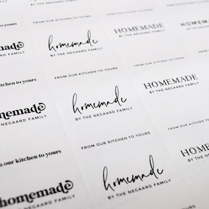 May include: A sheet of white paper with multiple labels printed with the text "Homemade by the Negaard Family" and "From our kitchen to yours".