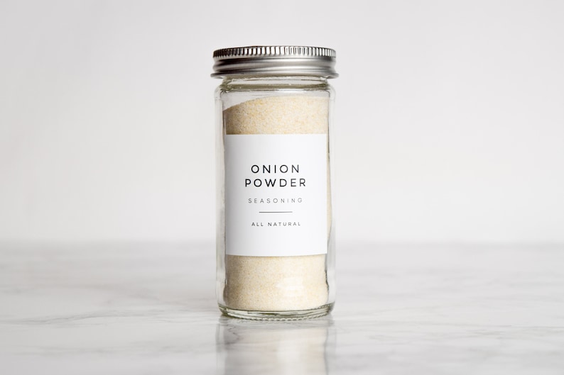 May include: A glass jar with a silver lid filled with onion powder. The label reads "Onion Powder Seasoning All Natural".