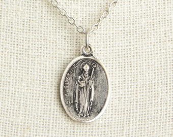 18-Inch Rhodium Plated Necklace with 6mm Garnet Birthstone Beads and Sterling Silver Saint Augustine of Hippo Charm. 18-Inch Rhodium Plated Necklace with 6mm Garnet Birthstone Beads and Sterling Silver Saint Augustine of Hippo Charm.