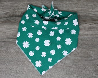 May include: Green bandana with white shamrock pattern.