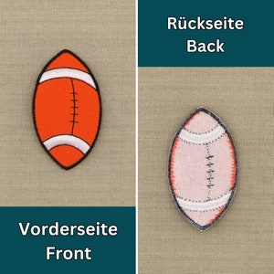May include: Two embroidered iron-on patches of a football. The front side is orange with white stitching and the back side is white with orange stitching. The text "Vorderseite Front" is on the left and "R&uuml;ckseite Back" is on the right.