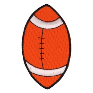 May include: An orange and white embroidered football patch. The football is outlined in black.