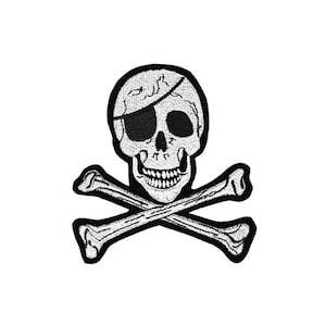 May include: Black and white embroidered patch of a skull and crossbones. The skull has a black eye patch and a toothy grin.