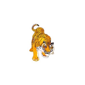 May include: A close-up of a tiger with orange and black stripes, looking directly at the viewer. The tiger is in a crouched position, with its head lowered and its paws extended.