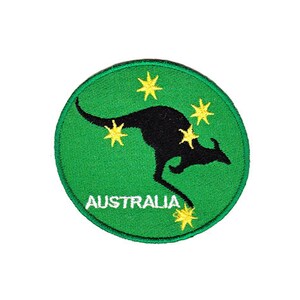 May include: A green circular patch featuring a black kangaroo silhouette and yellow stars. The text "AUSTRALIA" is embroidered in white below the kangaroo.