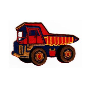 May include: Red and blue embroidered iron-on patch of a dumper truck. The truck has a yellow bed and black wheels.