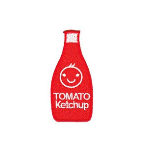 May include: A red embroidered patch in the shape of a ketchup bottle. The patch features a smiling face and the words "TOMATO KETCHUP" in white. The bottle has a white top.