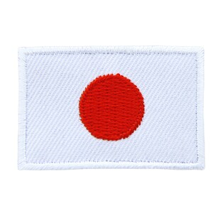 Könnte beinhalten: Ein weißer gestickter Aufnäher mit einem roten Kreis in der Mitte, der die Flagge Japans darstellt.