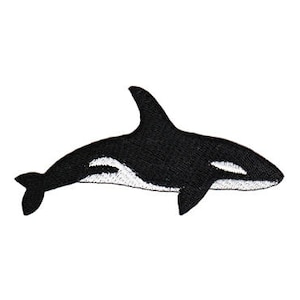 Könnte beinhalten: Schwarzer und weißer gestickter Aufnäher einer Orca, oder eines Schwertwals, der nach rechts schwimmt.