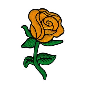 May include: An embroidered rose in yellow with green leaves and stem.