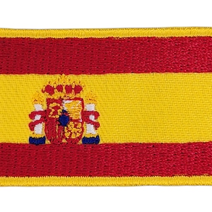 Puede incluir: Parche bordado de la bandera española. La bandera es roja y amarilla con el escudo de armas español en el centro.