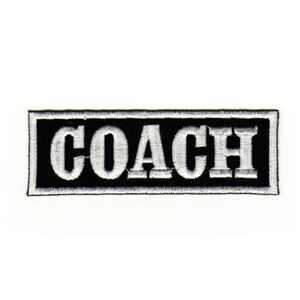May include: Black and white embroidered patch with the word "COACH" in white lettering.